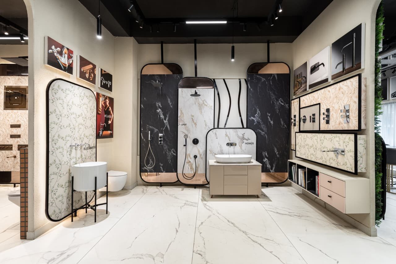 Bath fittings displayed on marble plates at IDC