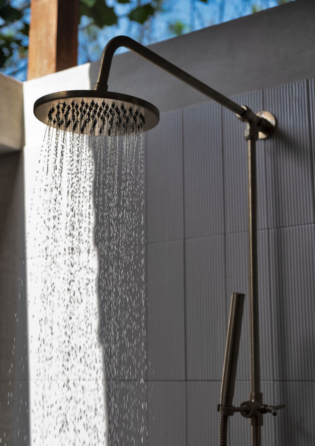 Brushed bronze rain shower flowing — Wellness & shower systems — Imperial Design Concepts, Mohali